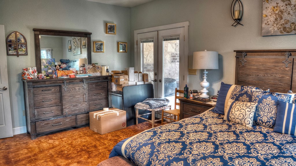 4573 Ranch Road 1120 Rio Frio, TX 78879 - Photo 28 of 71 a living room with furniture a lamp and a fireplace