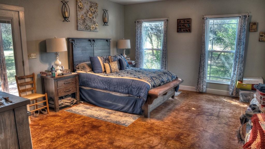 4573 Ranch Road 1120 Rio Frio, TX 78879 - Photo 29 of 71 a bed room with a bed and a chair