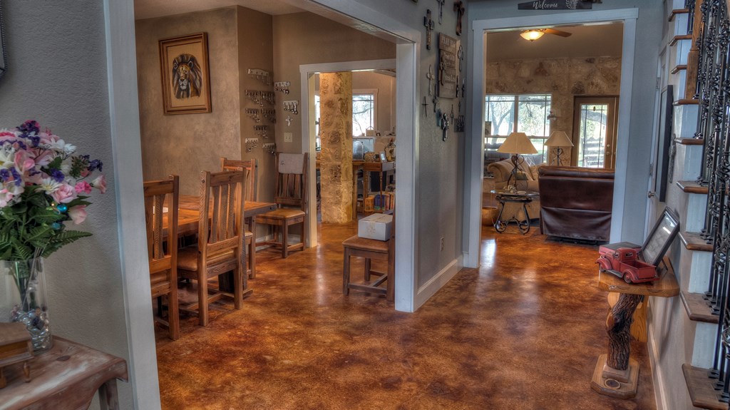 4573 Ranch Road 1120 Rio Frio, TX 78879 - Photo 33 of 71 a view of a hallway with wooden floor and a potted plant