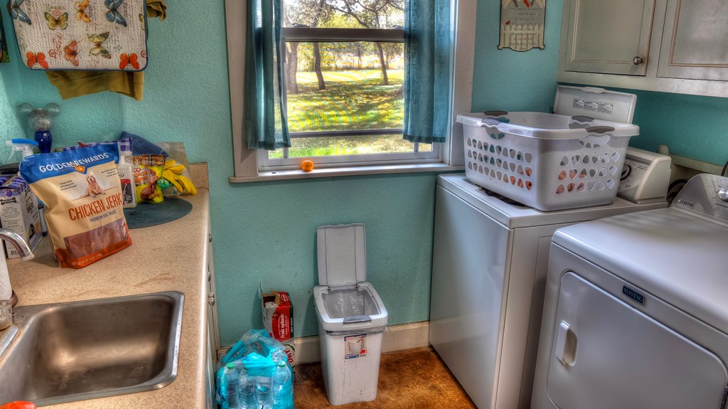 4573 Ranch Road 1120 Rio Frio, TX 78879 - Photo 35 of 71 a utility room with dryer and washer