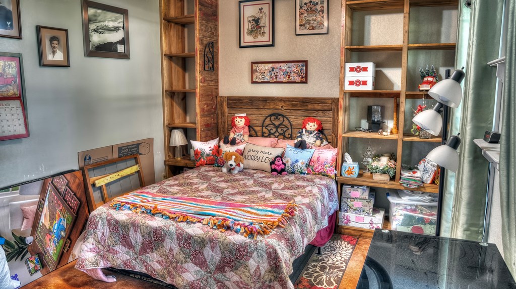 4573 Ranch Road 1120 Rio Frio, TX 78879 - Photo 36 of 71 a bedroom with a bed and a bookshelf