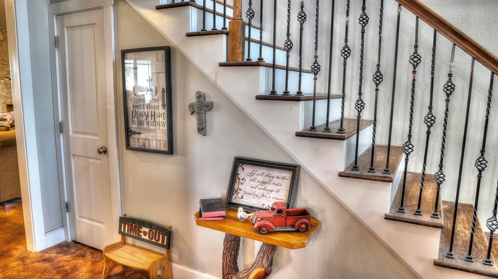 4573 Ranch Road 1120 Rio Frio, TX 78879 - Photo 37 of 71 a view of entryway with wooden floor and stairs