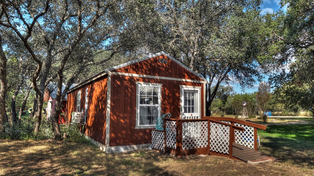 4573 Ranch Road 1120 Rio Frio, TX 78879 - Photo 49 of 71 a front view of a house with garden