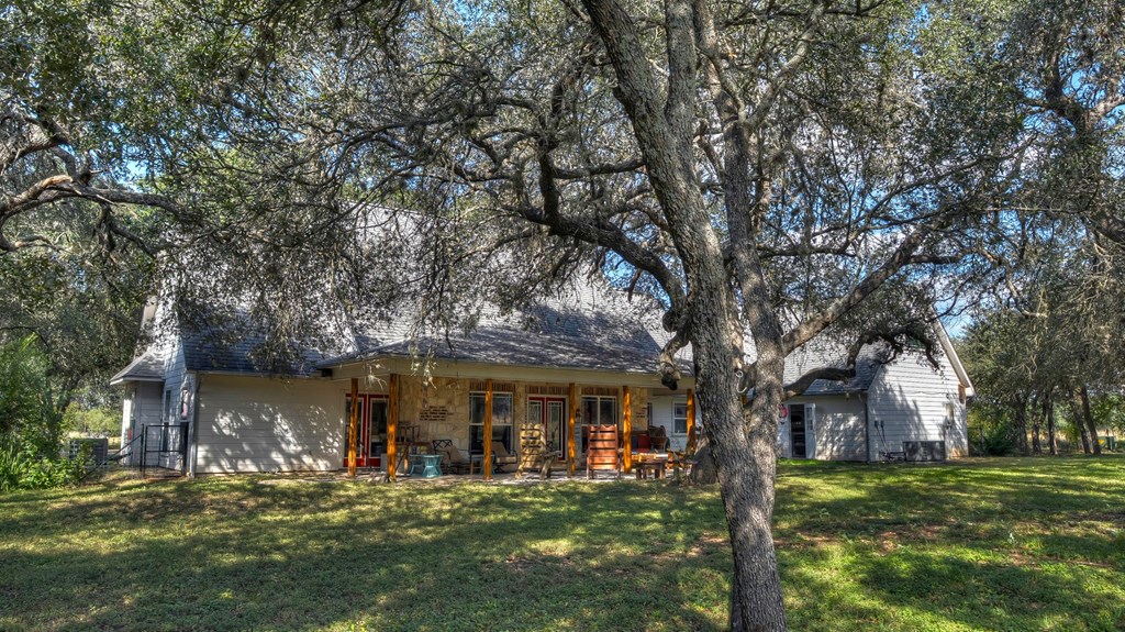 4573 Ranch Road 1120 Rio Frio, TX 78879 - Photo 9 of 71 a front view of a house with a garden