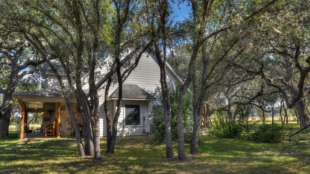 4573 Ranch Road 1120 Rio Frio, TX 78879 - Photo 10 of 70 a front view of a house with a yard