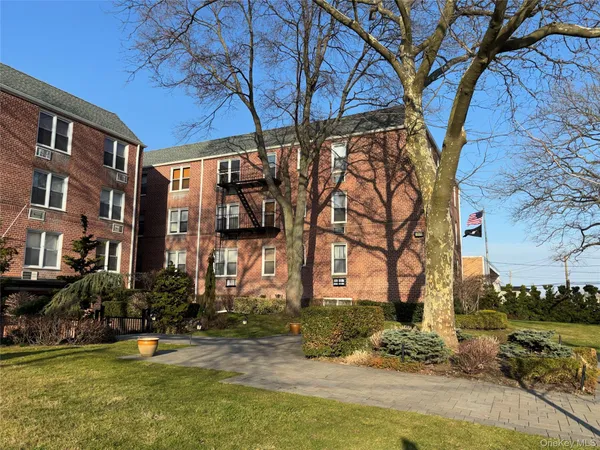 a view of a building with a yard