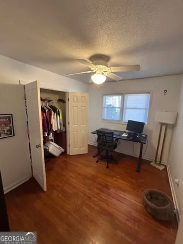 a living room with furniture and a piano