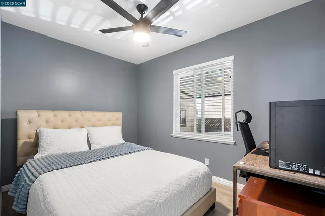 a bedroom with a bed and furniture