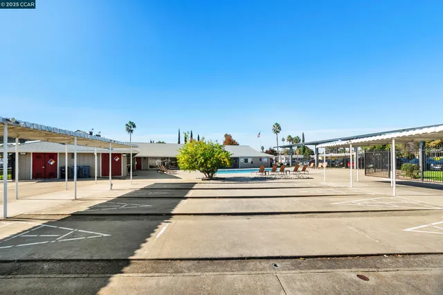 a view of swimming pool with outdoor seating