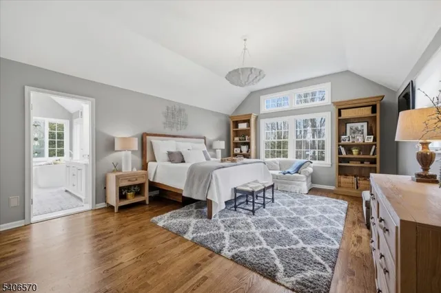 a bed room with a bed and a large window