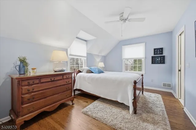 a bed room with a bed and a window