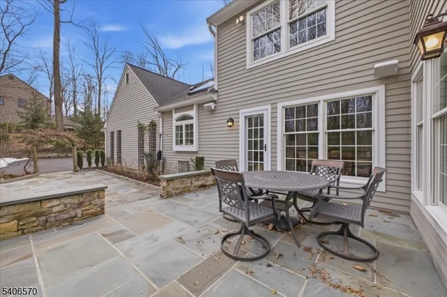 a view of a dinning table and chairs in the patio