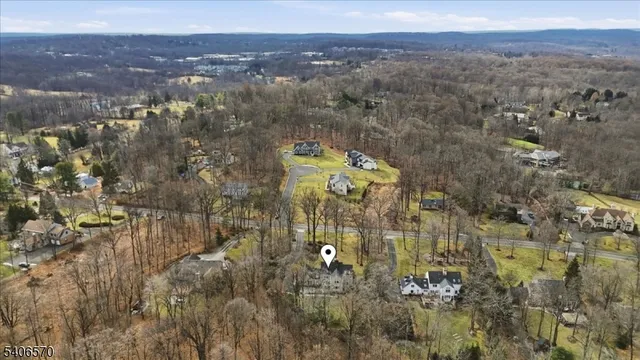 a aerial view of a house with swimming pool and sitting space