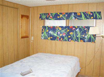 228 Ricardo Avenue Santa Rosa, CA 95407 - Photo 8 of 8 a bedroom with a bed and a table