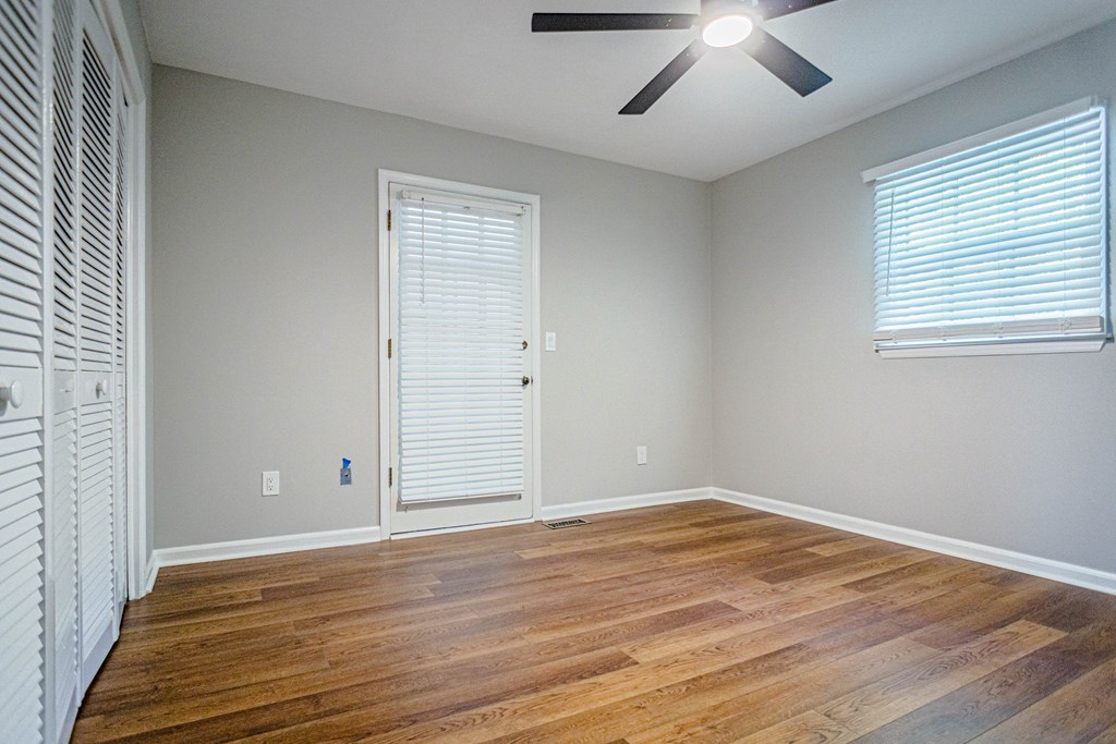 6221 Charing Drive Columbus, GA 31909 - Photo 12 of 18 an empty room with wooden floor and windows