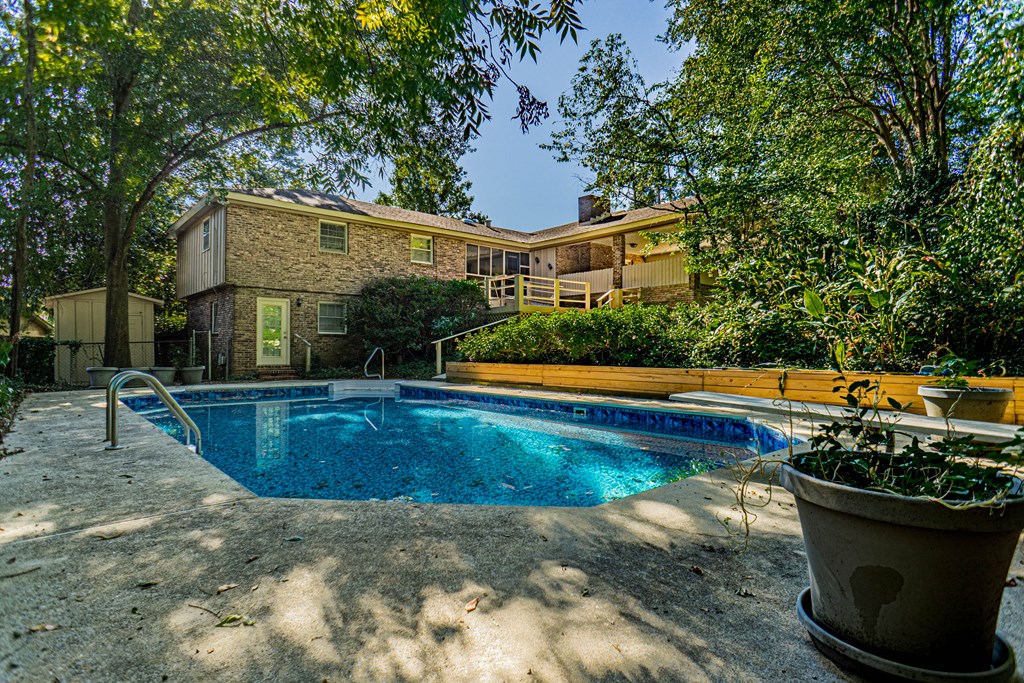 6221 Charing Drive Columbus, GA 31909 - Photo 18 of 18 a view of a house with swimming pool and yard