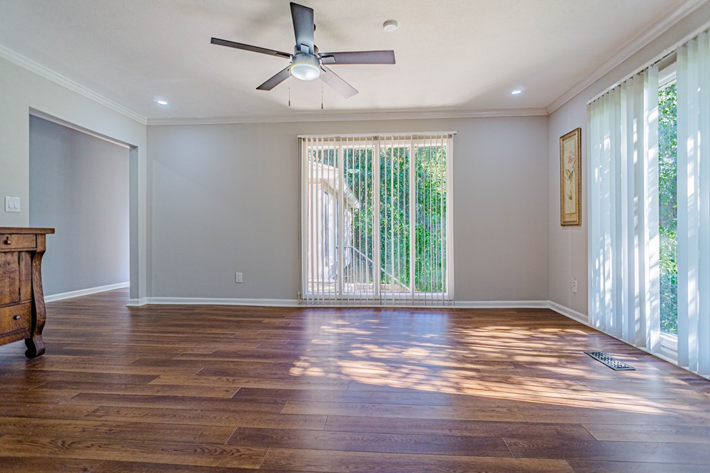 6221 Charing Drive Columbus, GA 31909 - Photo 8 of 18 a view of an empty room with wooden floor and a window