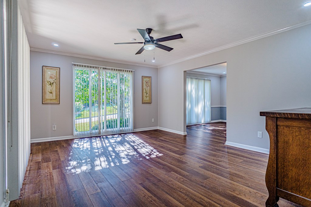 6221 Charing Drive Columbus, GA 31909 - Photo 9 of 18 a view of an empty room with wooden floor and a window