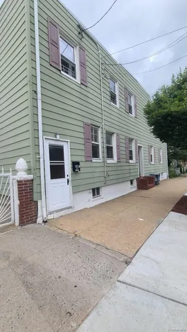 a view of a house with a yard and garage