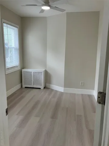 an empty room with a empty space and window