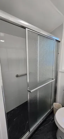 a view of a hallway with windows