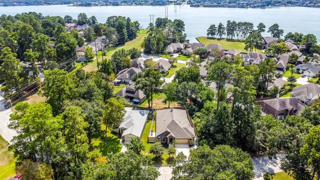 an aerial view of a houses with yard