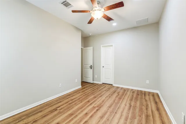 a view of room with wooden floor