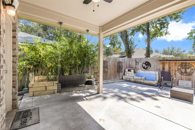 a living room filled with furniture and a floor to ceiling window