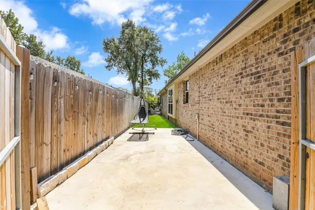 a view of a pathway with a wooden fence