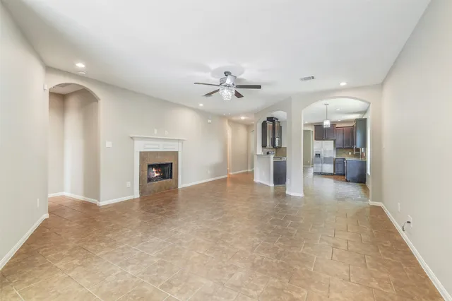 wooden floor in an empty room with a fireplace