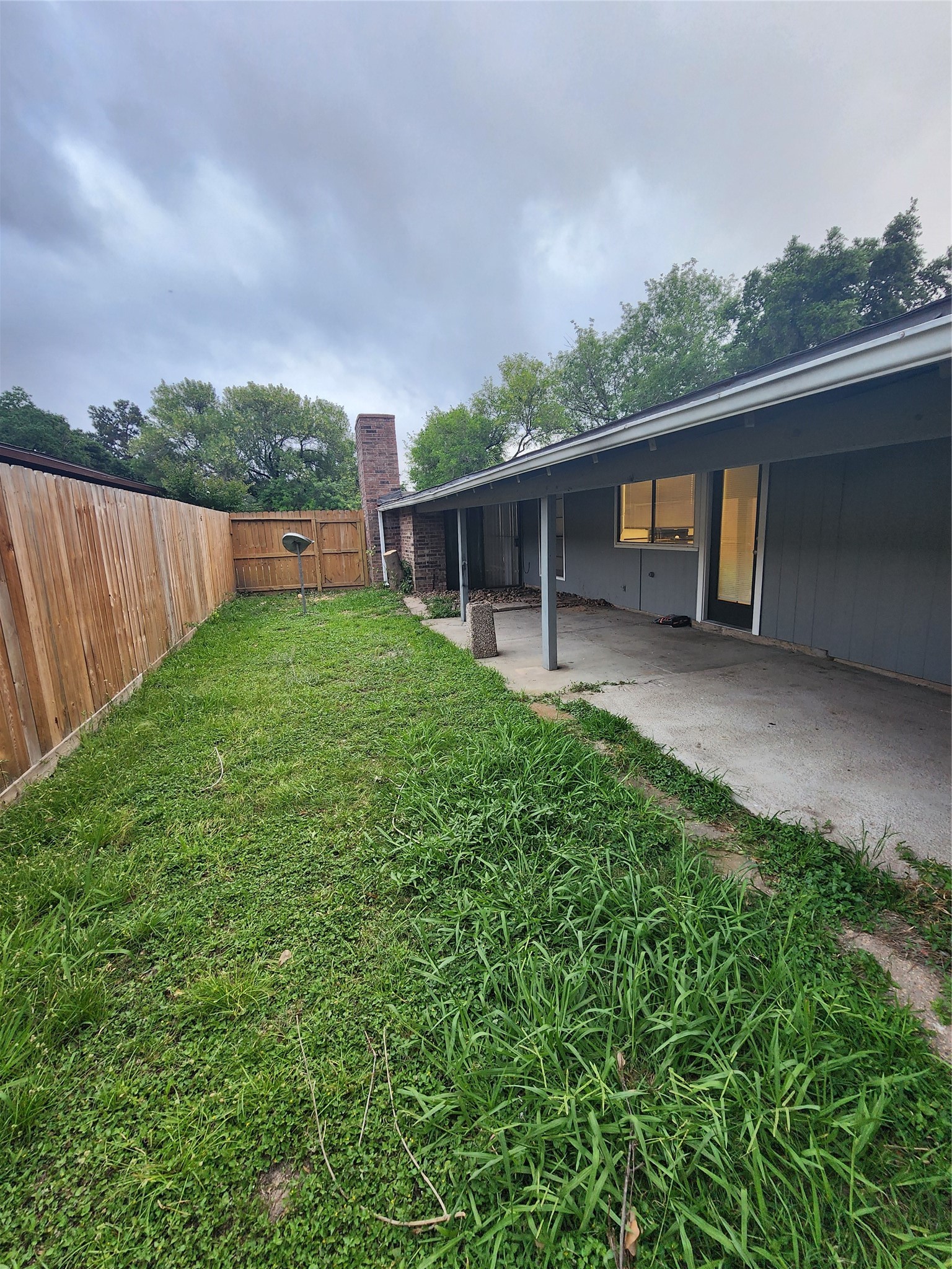 3822 Broken Elm Drive Spring, TX 77388 - Photo 16 of 25 a backyard of a house with lots of green space and plants