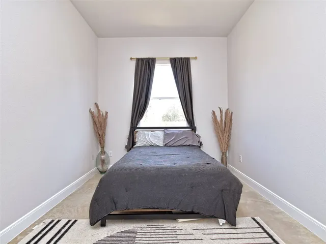 a living room with a couch and wooden floor