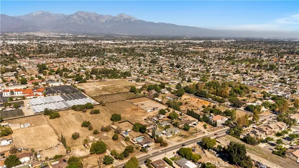 an aerial view of residential building and trees around