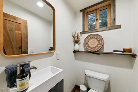 a bathroom with a toilet and a sink