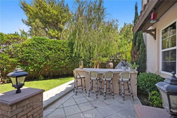 a view of outdoor sitting area with furniture and garden