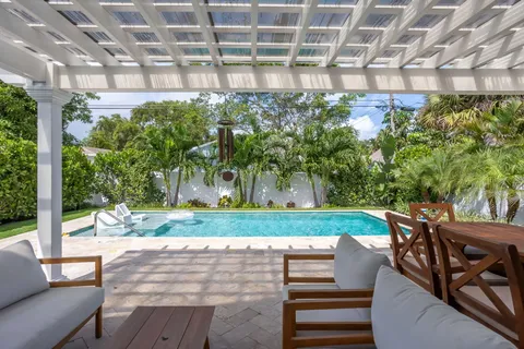 a view of a chairs and table in the patio
