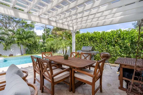a view of an outdoor space with a table and chairs