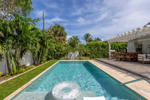 a view of a backyard with sitting area