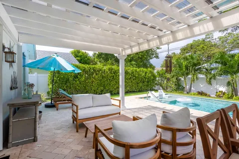 a patio with a table and chairs