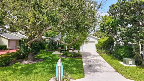 a view of park with large trees
