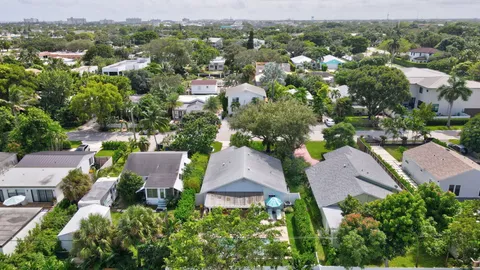 an aerial view of multiple houses with yard
