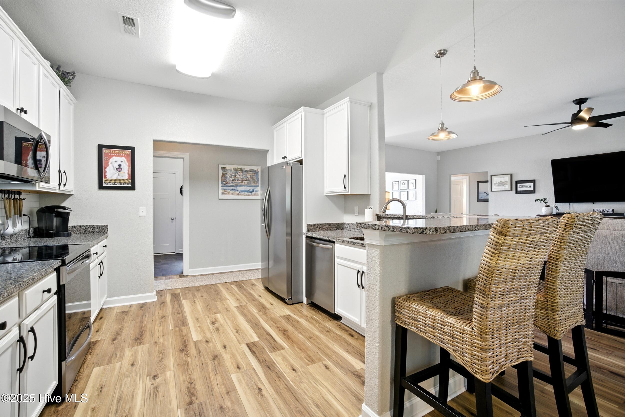 100 Rosedale Court Moyock, NC 27958 - Photo 14 of 50 Kitchen bar-top for extra seating