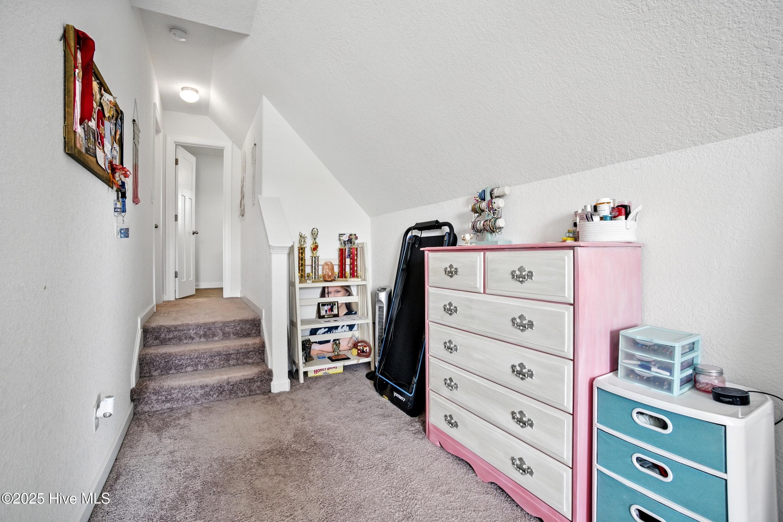 100 Rosedale Court Moyock, NC 27958 - Photo 33 of 50 FROG has a landing area leading to a large walk in closet and private full bathroom