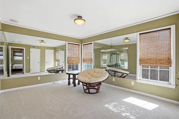 a living room with a couch and a large window