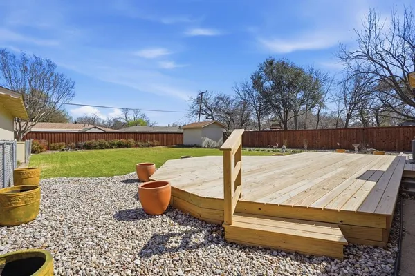 a view of a backyard with sitting area