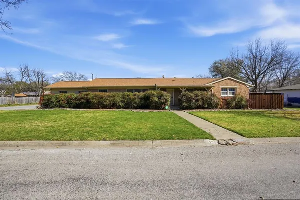 a view of a house with snow on the road