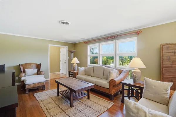 a bedroom with bed and a chandelier