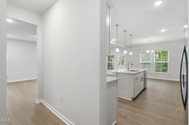 a large bathroom with a sink a large mirror and a shower