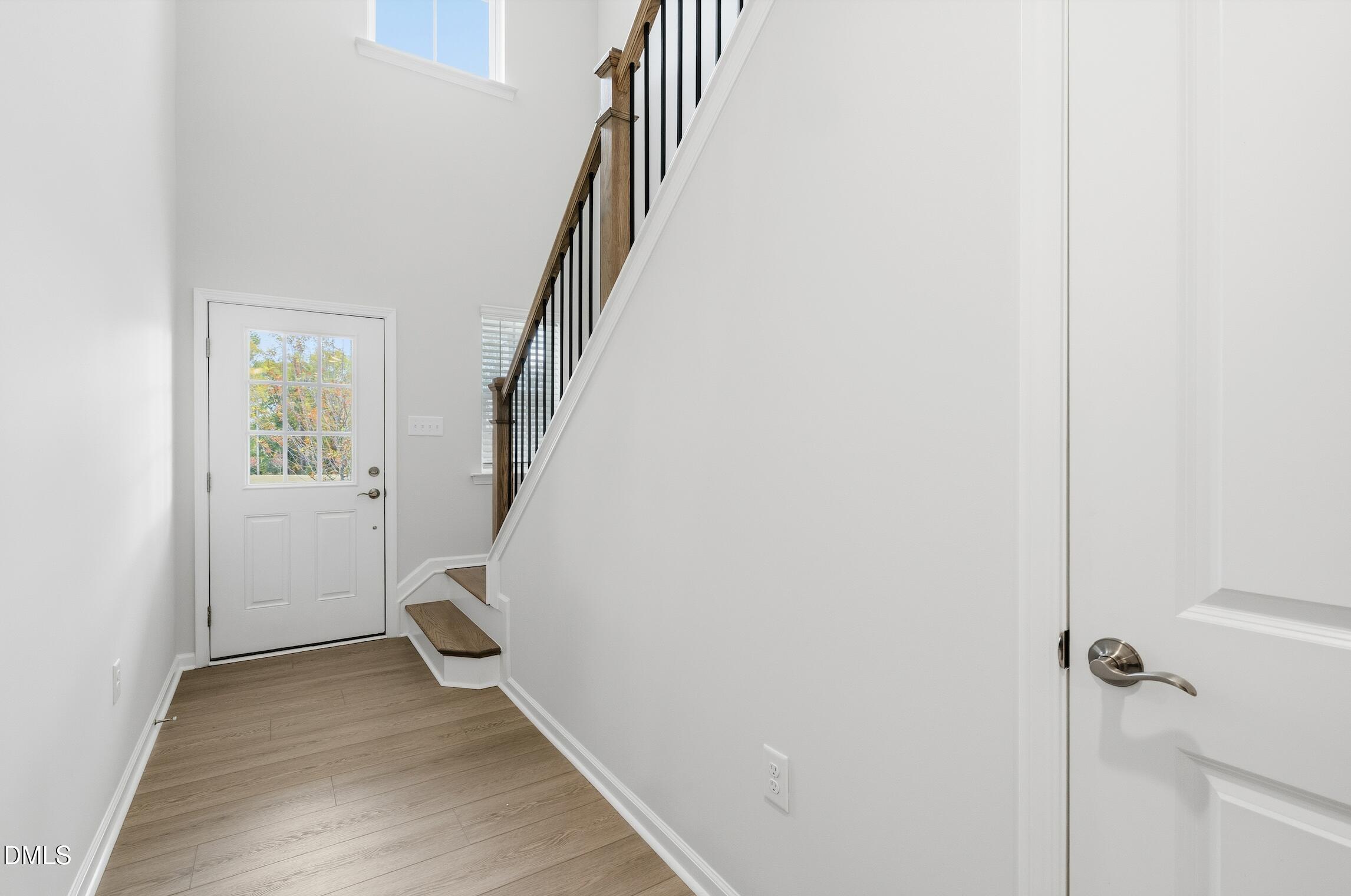 505 Providence Springs Lane Fuquay-Varina, NC 27526 - Photo 21 of 40 a view of entryway with stairs and wooden floor