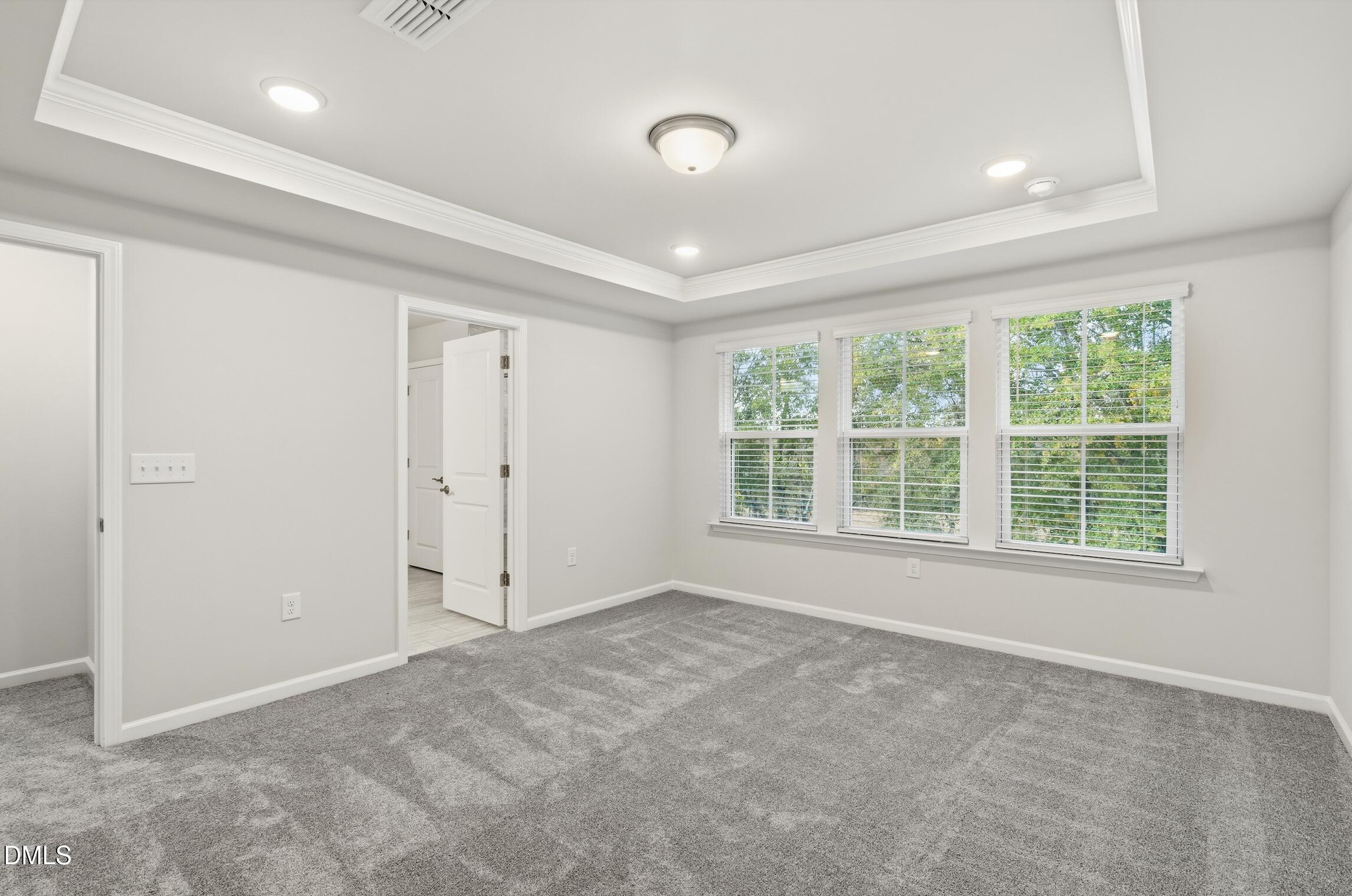 505 Providence Springs Lane Fuquay-Varina, NC 27526 - Photo 29 of 40 an empty room with a empty space and windows